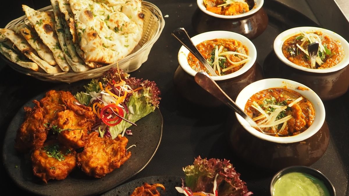 Traditional South Asian iftar spread with fried snacks during Ramadan in Bangladesh