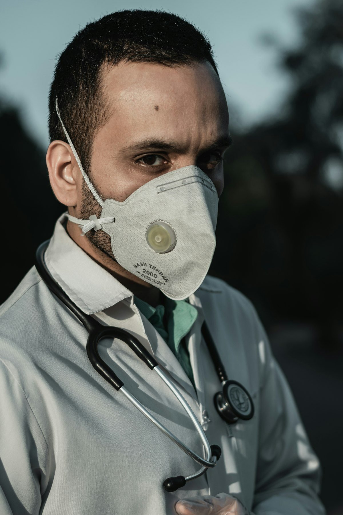 Person wearing an N95 respirator mask for protection against air pollution in Dhaka, Bangladesh