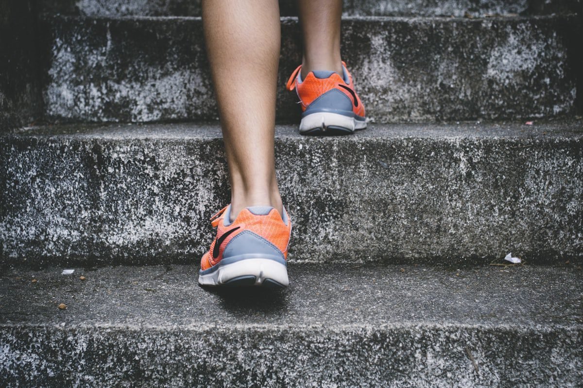 Running shoes climbing stairs — boosting metabolism for fat loss in Bangladesh